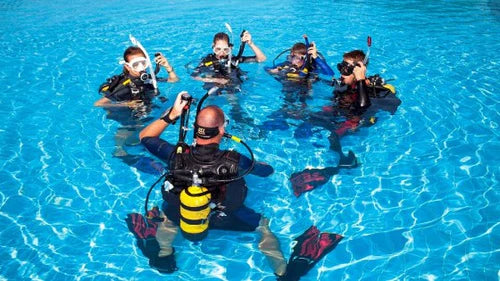 Divers Training in the pool Learning To Dive
